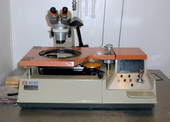 The automated probe station is used to test numerous detectors on a semiconductor wafer for operating characteristics. 