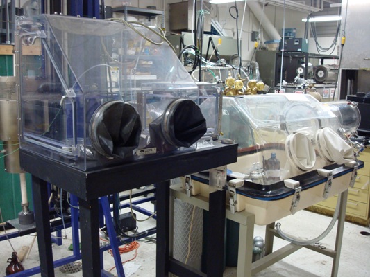 Glove boxes are used to prepare materials samples for crystal growth. 