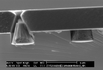 Films quite thick can be applied. Whereas before, cracking would occur with films of only 1 micron thick, shown is a well adhered film 4 microns thick. 