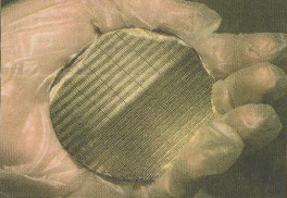 The neutron imaging arrays are fabricated using VLSI technology. As a result, numeous devices can be made for a relatively low cost. Shown is a wafer of GaAs-based neutron imaging arrays designed and developed in the K-State S.M.A.R.T. Laboratory. 