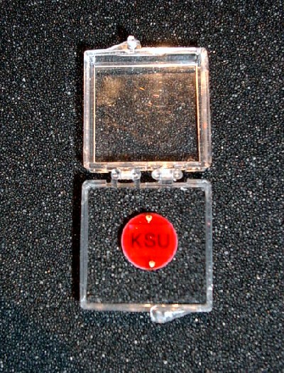 A closeup view of a coated-GaAs neutron detector designed, developed, and fabricated in the KSU SMART Laboratory. The detectors are coated with a proprietary encapsulate to prevent damage to the delicate devices and wire leads. As a result, the final device is robust and sturdy.  