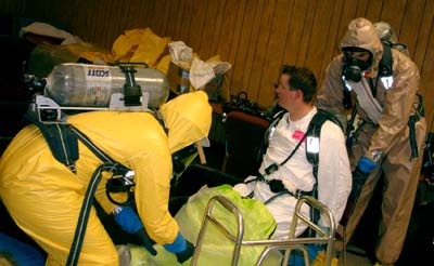 Level B suits are not completely sealed like the Level A suits, but both use an SCBA (self contained breathing apparatus) to protect the worker's lungs.  Level C suits lower the breathing protection to just a respirator.