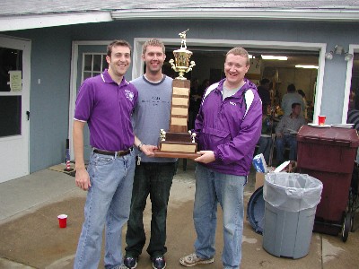 Winners of the 1st MNE SMART Laboratory Fall Invitational Scramble Tournament, Walter McNeil, Andy Fund, and Martin Ohmes display their trophy.